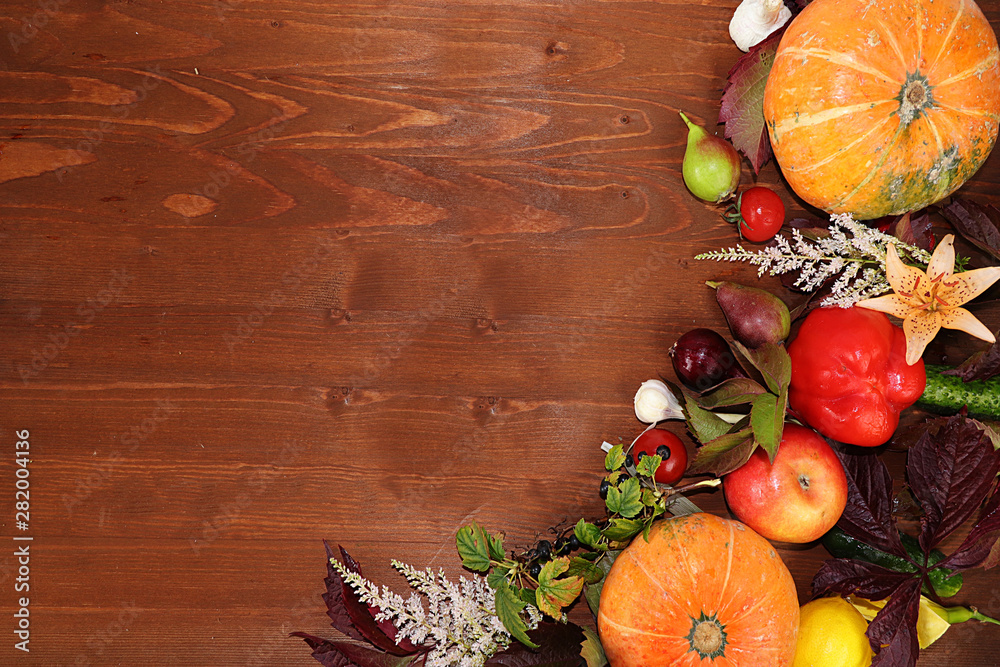 Thanksgiving, autumn background with seasonal autumn nature berries, pumpkins, apples and flowers on a wooden background, top view, copy space, flat lay. Happy Thanksgiving concept, selective focus.