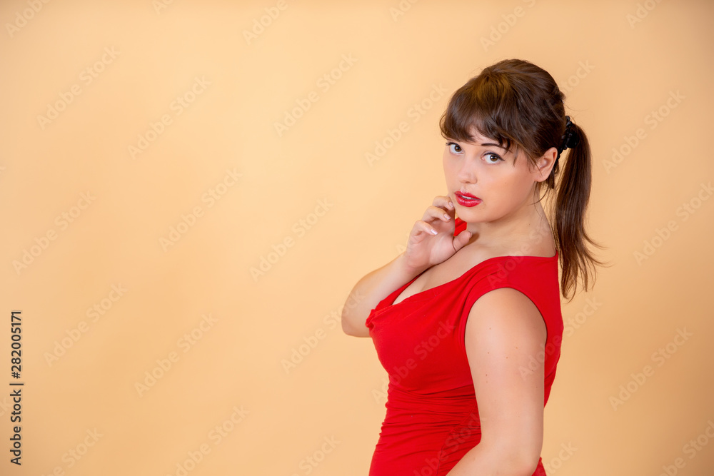 portrait of a smiling brunette in a red dress portrait of a smiling brunette in a red dress