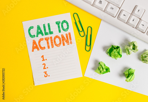 Conceptual hand writing showing Call To Action. Concept meaning exhortation do something in order achieve aim with problem Flat lay with copy space white paper with paper clips on the table photo