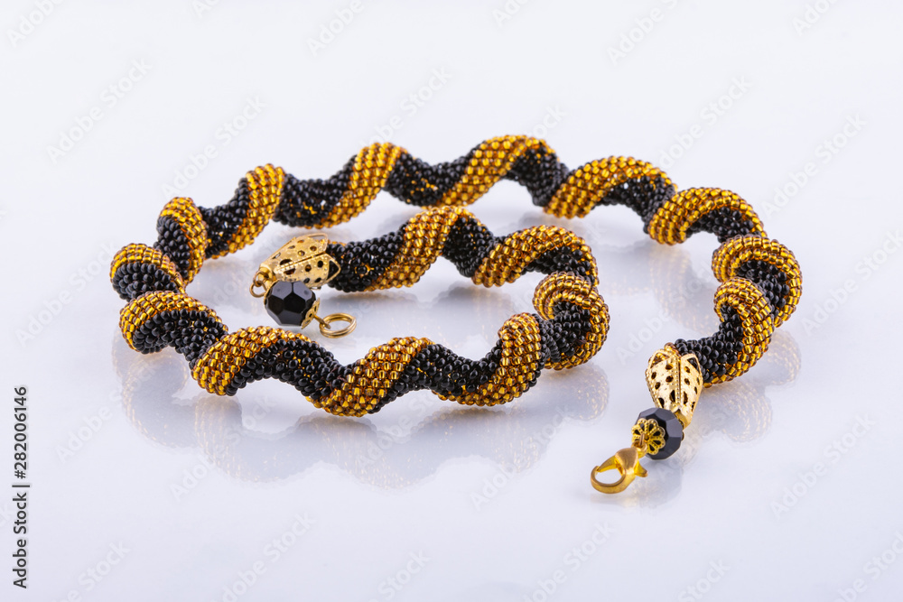 Handmade small bead bracelet in black and gold beads Handmade small bead bracelet in black and gold beads