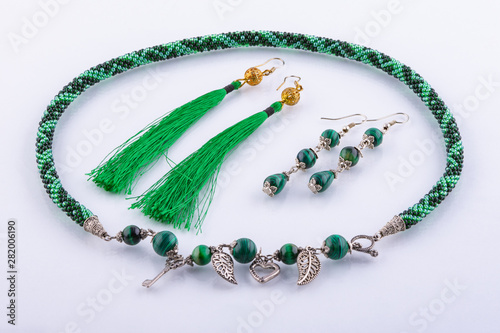 Necklace and two sets of earrings made of small beads and handmade stones