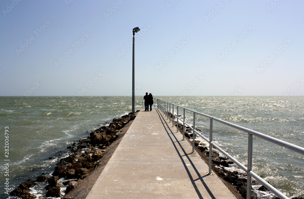 Back View Of Couple On Pier