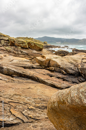 Muxia or Mugia rocky coastal view with pedras de abalar or oscillating stones on the Way of St. James, Camino de Santiago, Province of A Coruna, Galicia, Spain