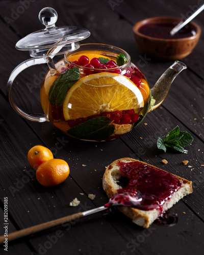 Fruit tea with oranges, cranberries, kumquat and mint
