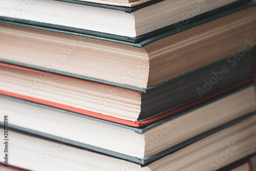 Stack of multicolored books closeup, education, reading, back to school concept,