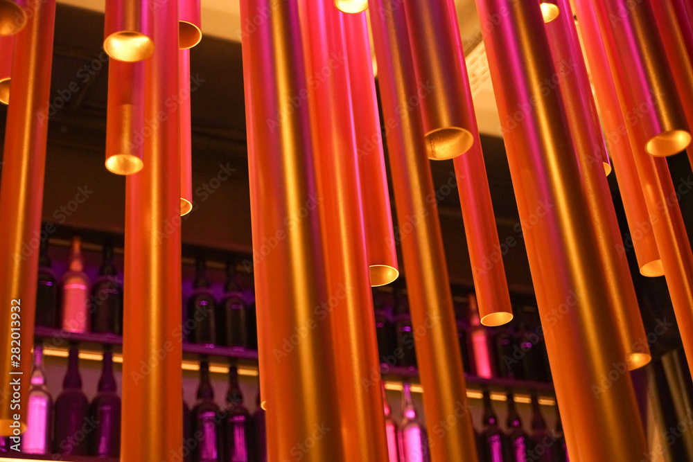 Abstract installation of plastic tubes in the interior. Unusual chandelier.