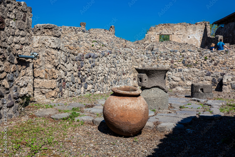 POMPEII, ITALY - APRIL, 2018: Tourists visiting the ruis of the ancient city of Pompeii in a beautiful early spring day POMPEII, ITALY - APRIL, 2018: Tourists visiting the ruis of the ancient city of Pompeii in a beautiful early spring day