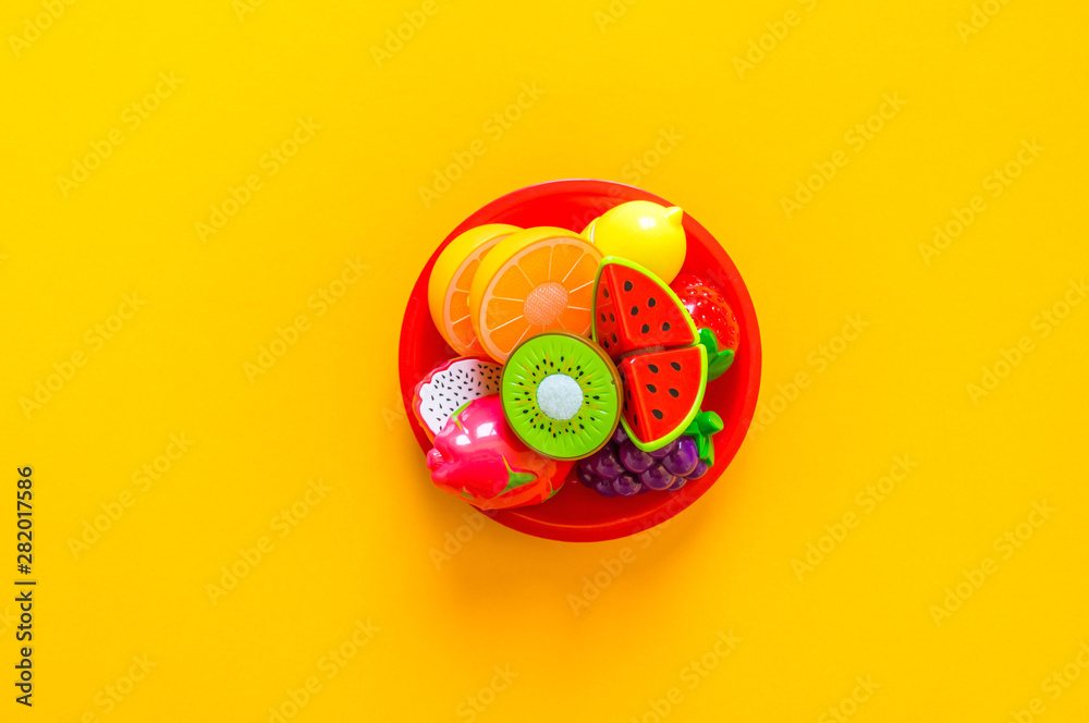 Children's toys vegetables fruits and products for the game of the store. Flat lay Copy space Children's toys vegetables fruits and products for the game of the store. Flat lay Copy space