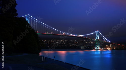 Beautiful Lions Gate bridge in night time near Vancouver, British Columbia photo