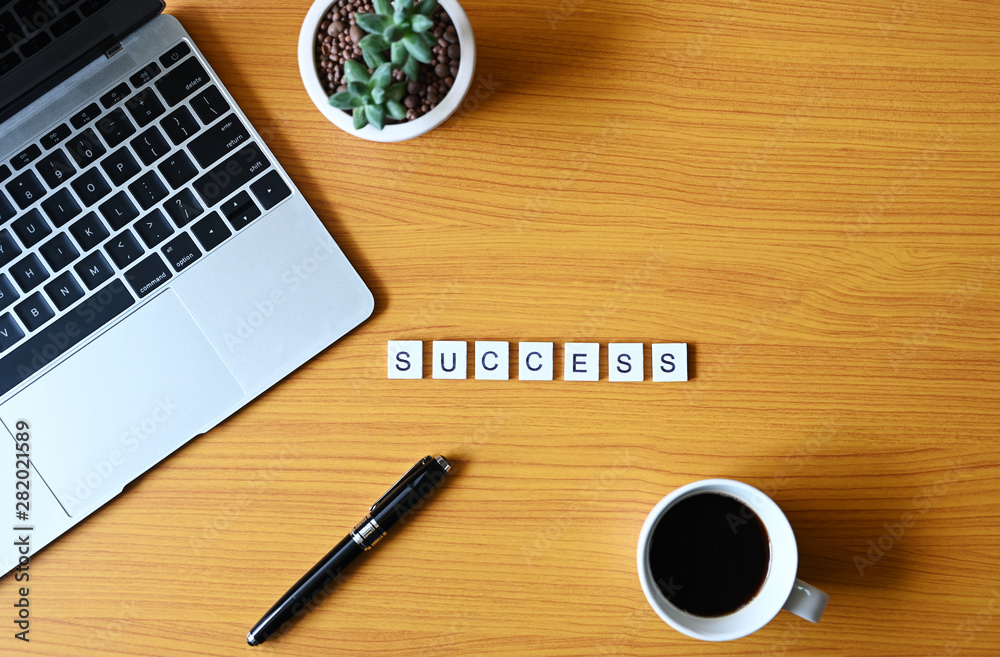 Success text With pen and laptop computer,Business concept