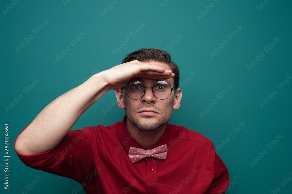 Portrait of a curious young man in glasses Portrait of a curious young man in glasses