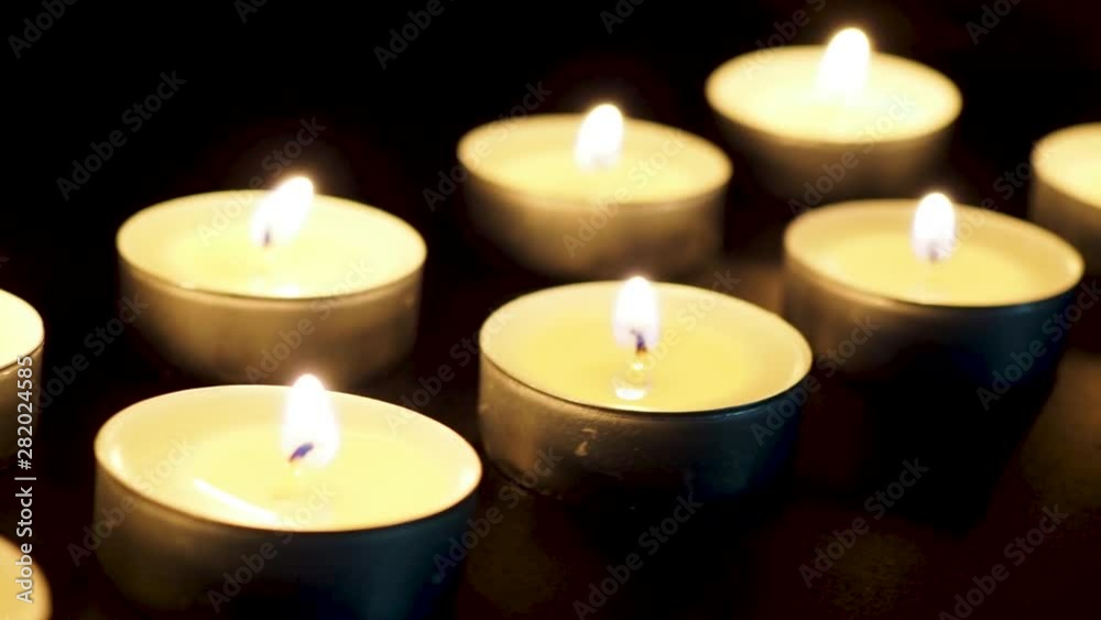 Candles in the dark glow lights macro dolly slide close-up Candles in the dark glow lights macro dolly slide close-up