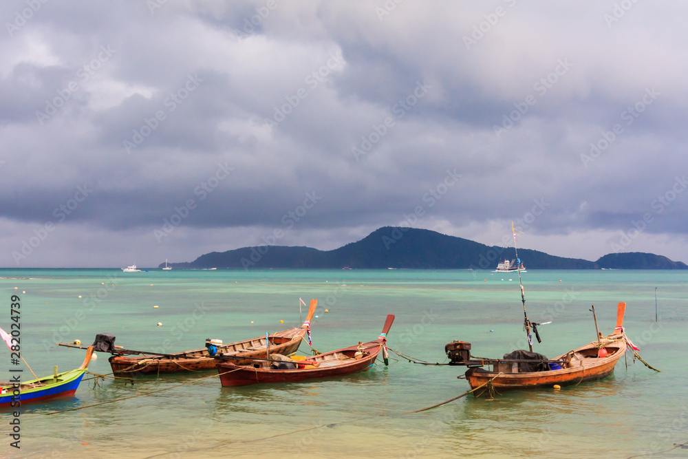 Fishing boats moored in a bay Fishing boats moored in a bay