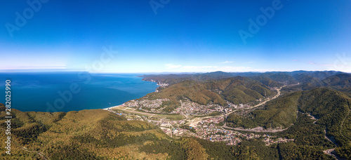 Agoy resort village on the Black Sea coast - drone aerial panorama view from mountain pass in summer sunny day