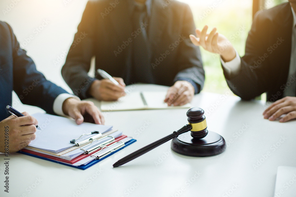 Group of business people and lawyers discussing contract papers ,Consultation between a male lawyer and businessman concept Group of business people and lawyers discussing contract papers ,Consultation between a male lawyer and businessman concept