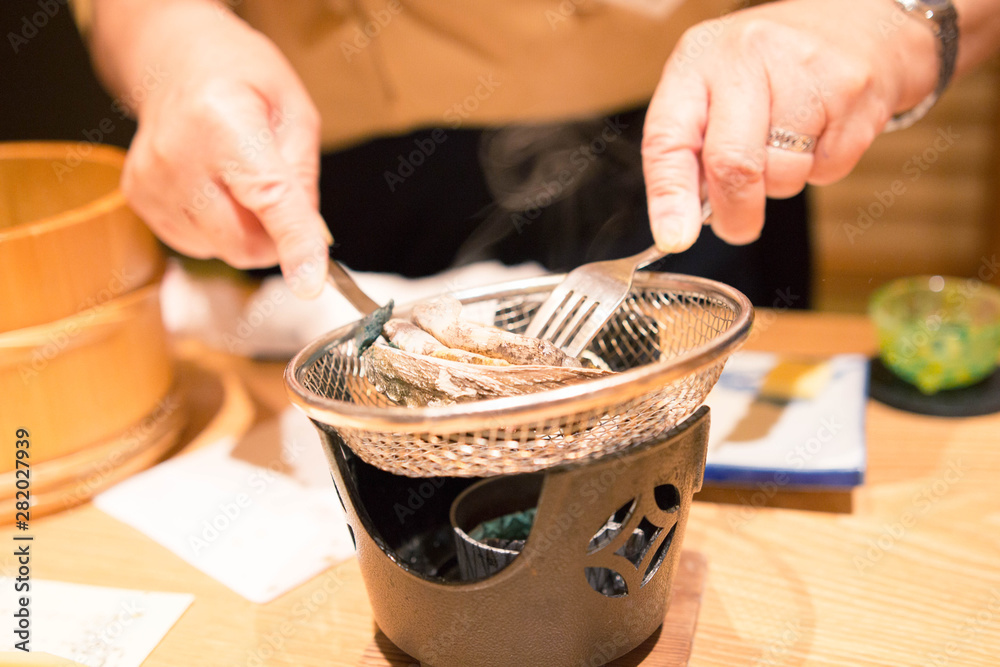 卓上コンロでアワビの踊り焼き 日本流のアワビの食べ方 Stock Photo Adobe Stock