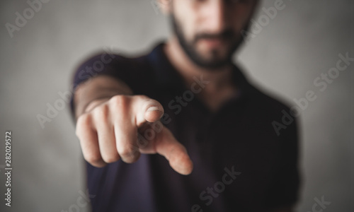 Caucasian man pointing finger at you. © andranik123