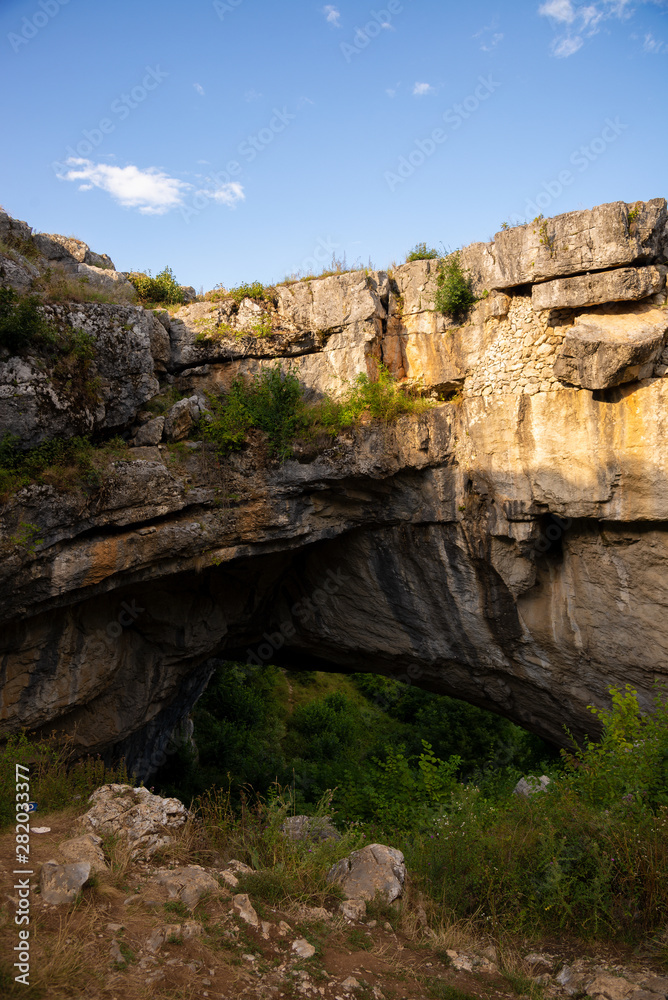landscape with God's Bridge a natural bridge in Romania landscape with God's Bridge a natural bridge in Romania