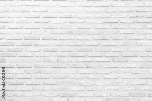 Wall white brick wall texture background in room at subway. Interior rock old clean uneven tile design, horizontal architecture wall.