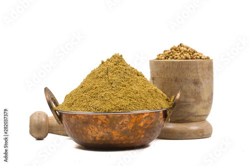 coriander powder with coriander seeds isolated on white background