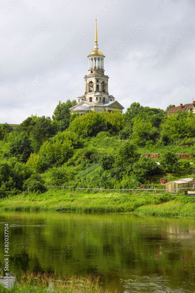 View of the bell tower of the Borisoglebsky monastery on a cloudy July day. Torzhok, Russia View of the bell tower of the Borisoglebsky monastery on a cloudy July day. Torzhok, Russia