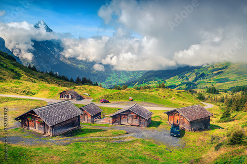 Alpine wooden farmhouses and mountain farmland, Grindelwald, Bernese Oberland, Switzerland