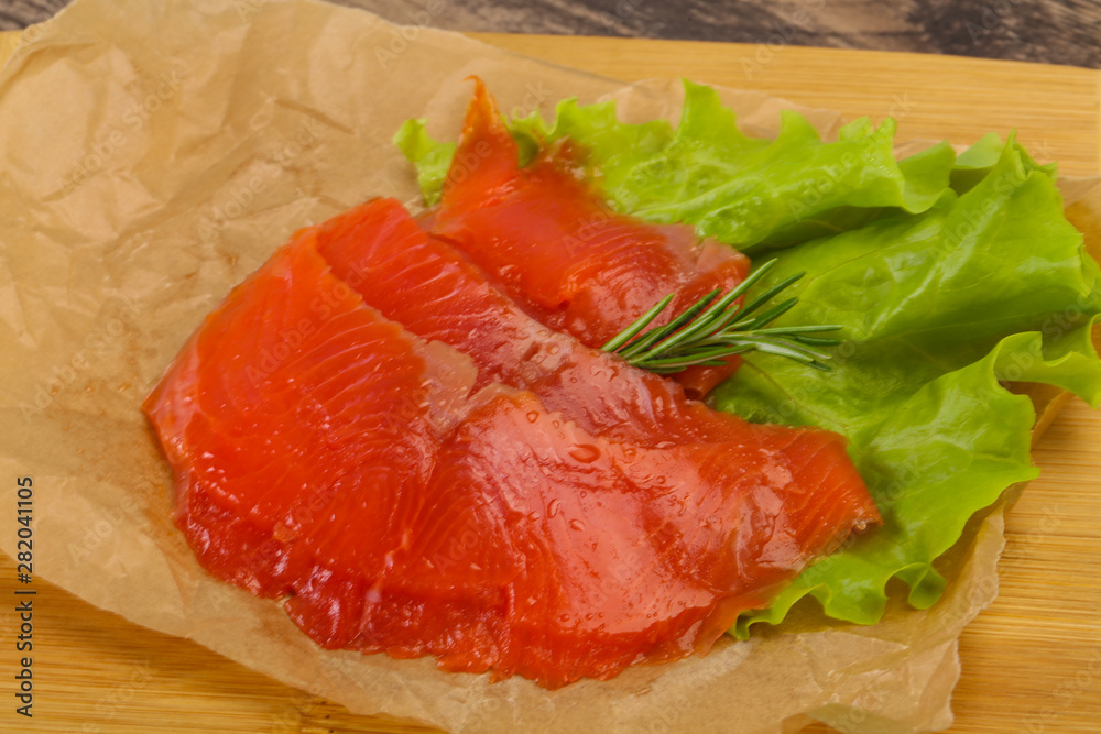Sliced salmon fillet served rosemary Sliced salmon fillet served rosemary