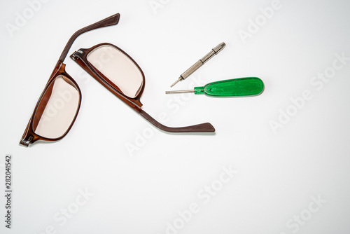 Broken glasses and repair tools