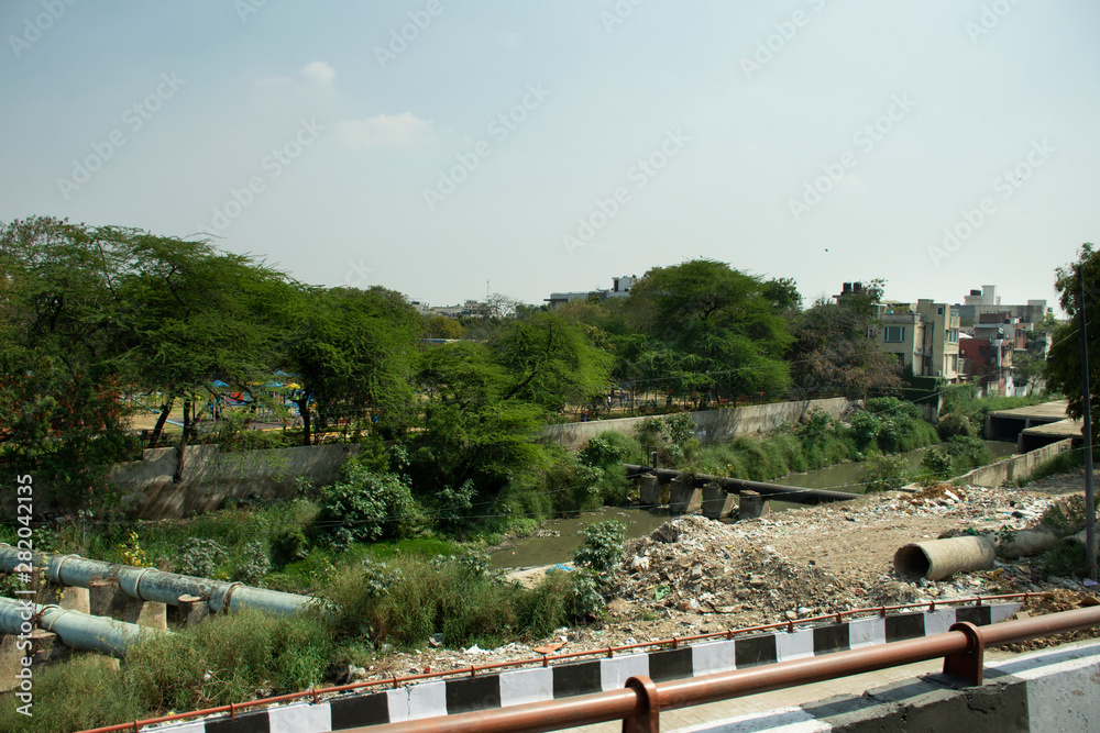 Life and lifestyle of Indian person and foreigners people at beside road of rural countryside in morning time at Delhi city in New Delhi, India