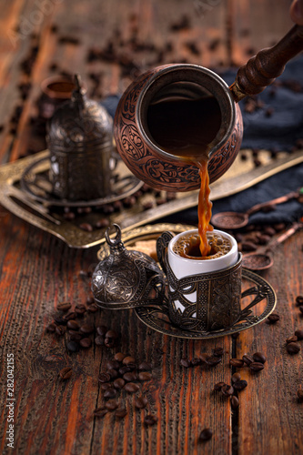 Pouring Turkish coffee photo