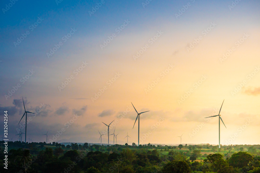 Green energy concept, eco power. Wind turbine located along the hill with the wind blowing all the time. Can produce renewable energy as well. Considered a clean energy. Green energy concept, eco power. Wind turbine located along the hill with the wind blowing all the time. Can produce renewable energy as well. Considered a clean energy.