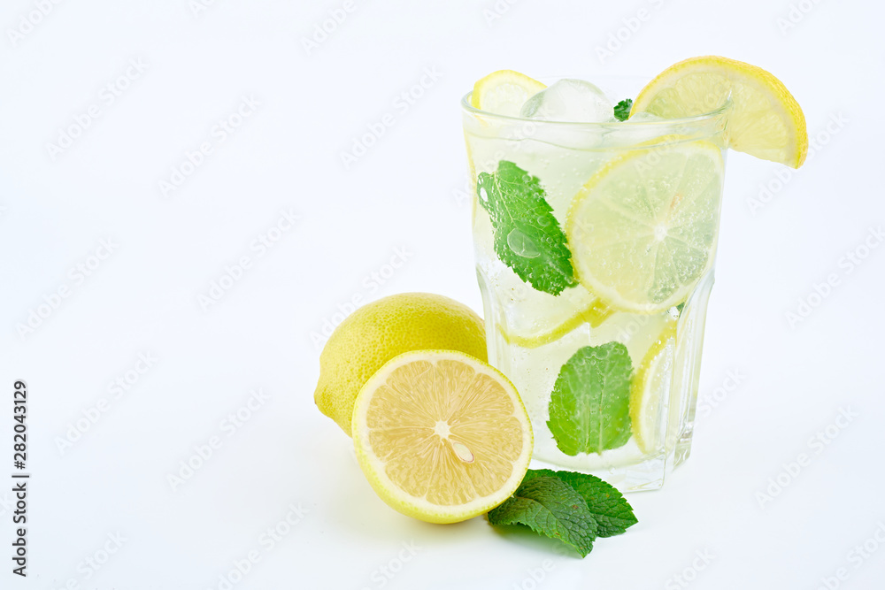 Mojito cocktail with lemon and mint in highball glass, isolated on a white background. Mojito cocktail with lemon and mint in highball glass, isolated on a white background.