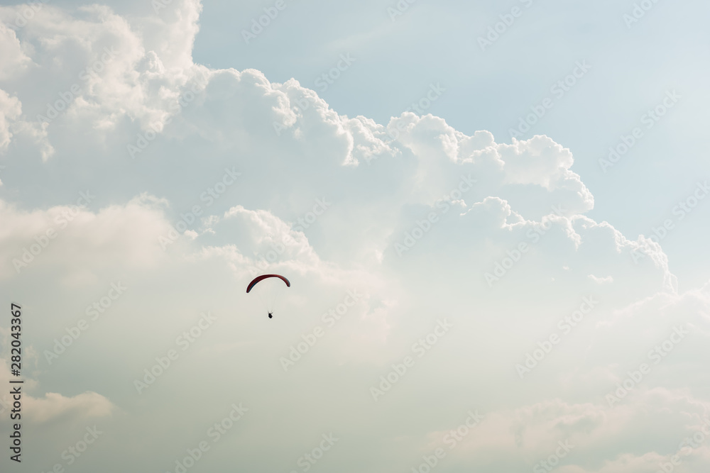 colorful paragliding over blue sky
