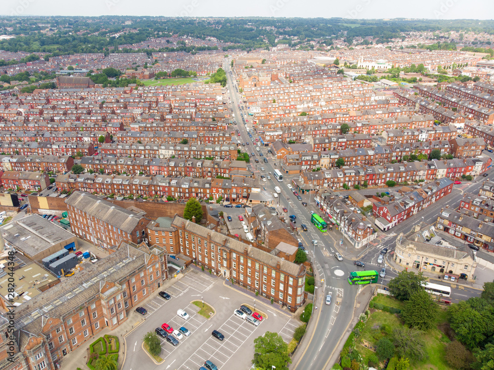 Aerial photo of the Leeds town of Harehills near the St. James's University Hospital in West Yorkshire, England, showing the Hospital grounds and the rows of houses in the town