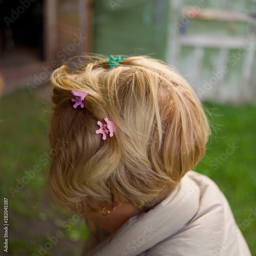 blonde woman with hair clips