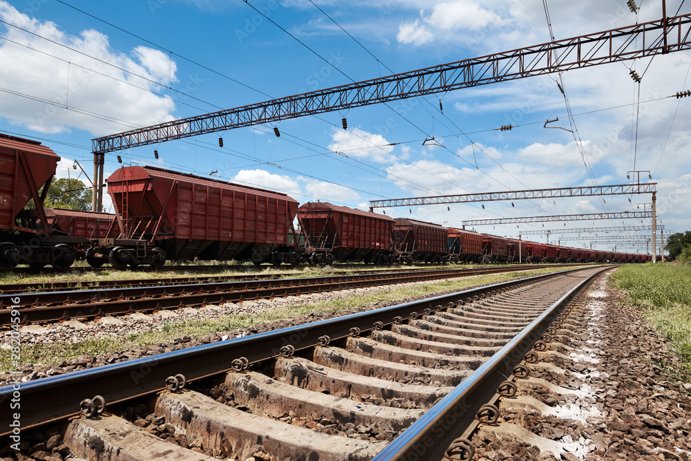 Industrial railway - wagons, rails and infrastructure, electric power supply, Cargo transportation and shipping concept. Industrial railway - wagons, rails and infrastructure, electric power supply, Cargo transportation and shipping concept.