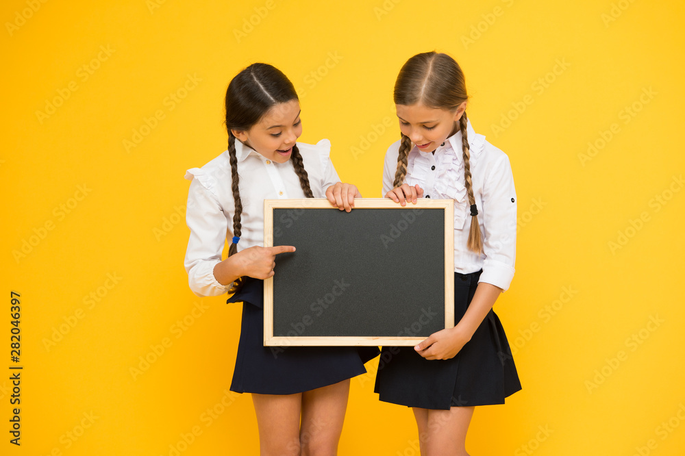 Pupils community. Classmates initiative team yellow background. Join school club. School schedule. School announcement concept. Check this out. School girls cute pupils hold blackboard copy space Pupils community. Classmates initiative team yellow background. Join school club. School schedule. School announcement concept. Check this out. School girls cute pupils hold blackboard copy space