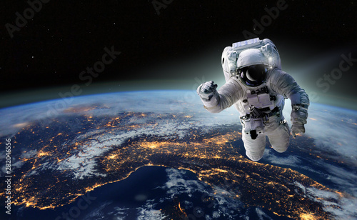 Fototapeta Naklejka Na Ścianę i Meble -  Concept of conquering the universe by the human race. Elements of this image furnished by NASA
