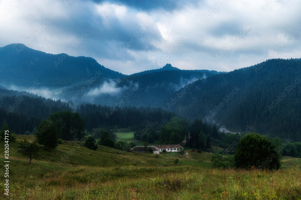 Foggy morning over Chairski lakes chalet in Rhodope mountain, Bulgaria
