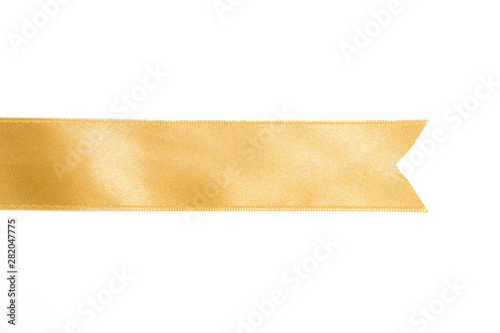 Gold ribbon in roll on white