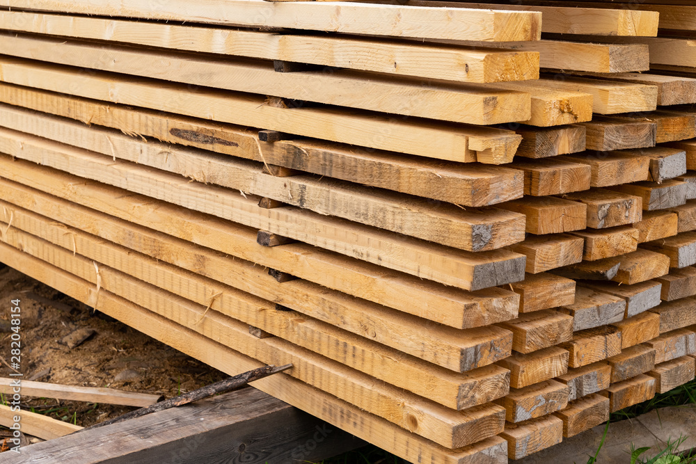 stack of long beige boards high dried building materials eco background horizontal pattern stack of long beige boards high dried building materials eco background horizontal pattern