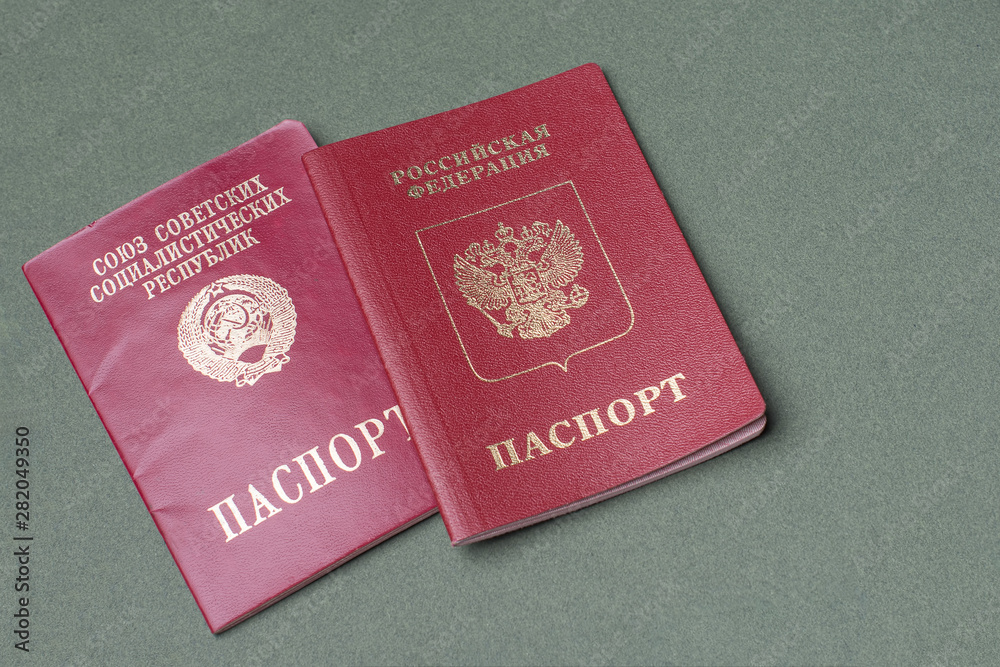 The passport of the Russian Federation and the Soviet Union on a green background The passport of the Russian Federation and the Soviet Union on a green background