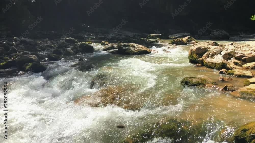 Natural, clean water stream in canyon (Russia, summer) Natural, clean water stream in canyon (Russia, summer)