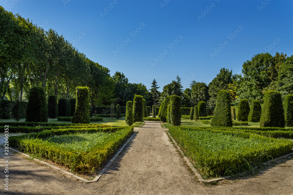 Traditional ornamental french garden and trees