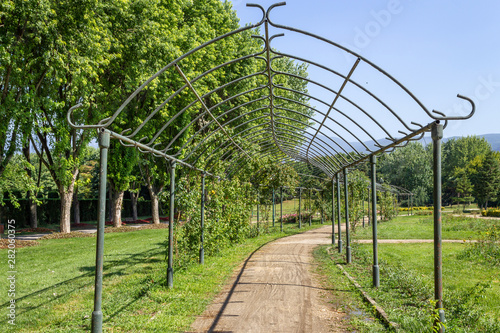 Ornamental garden iron trellis arch gate walking path