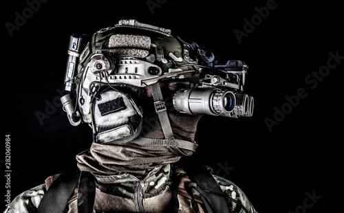 Soldier in night view goggles low key studio shoot