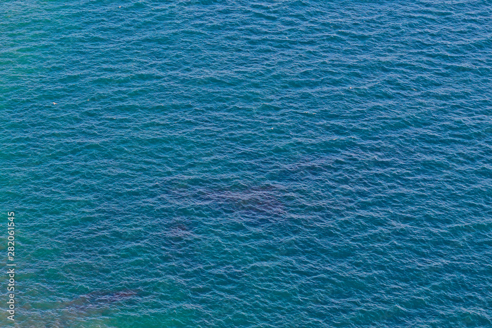 Fototapeta premium Calm waves on the ocean, top view