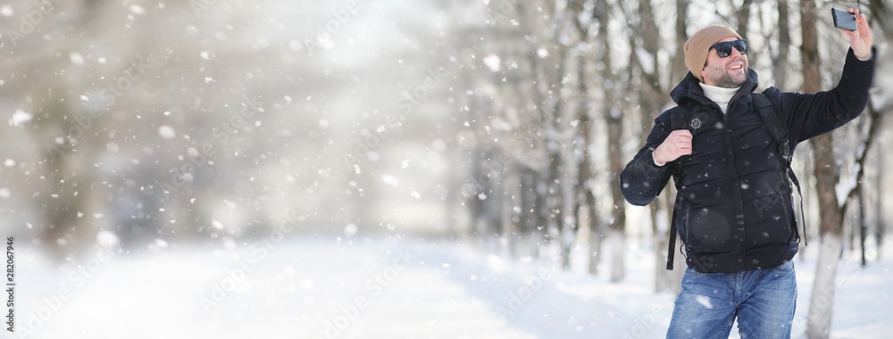 A man with a backpack frosty winter A man with a backpack frosty winter