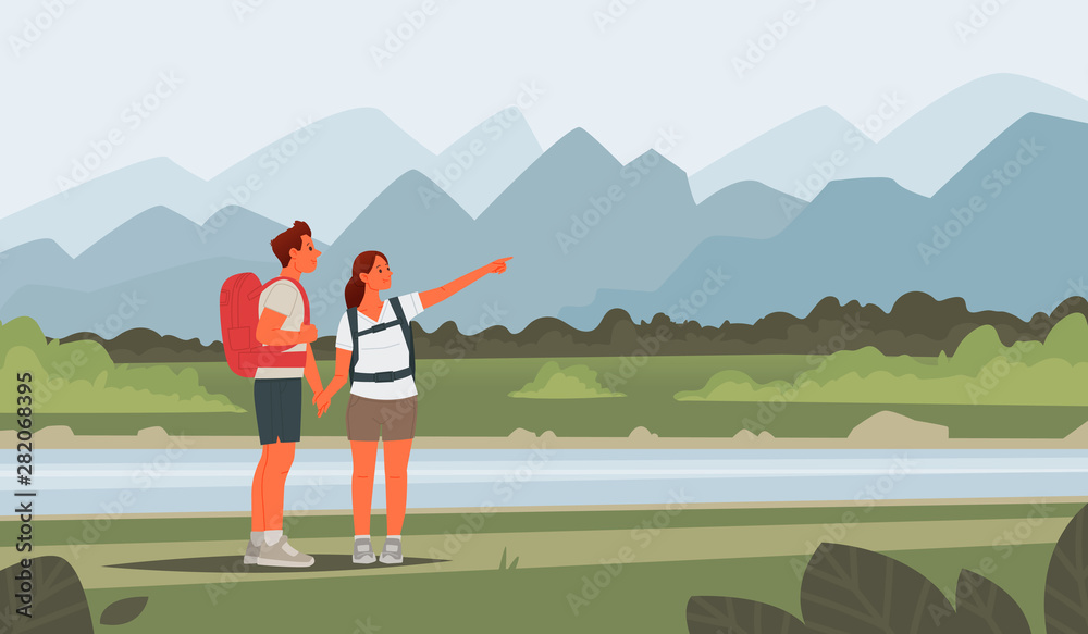 Happy couple of young people go hiking. Man and woman with backpacks on a background of mountainous landscape