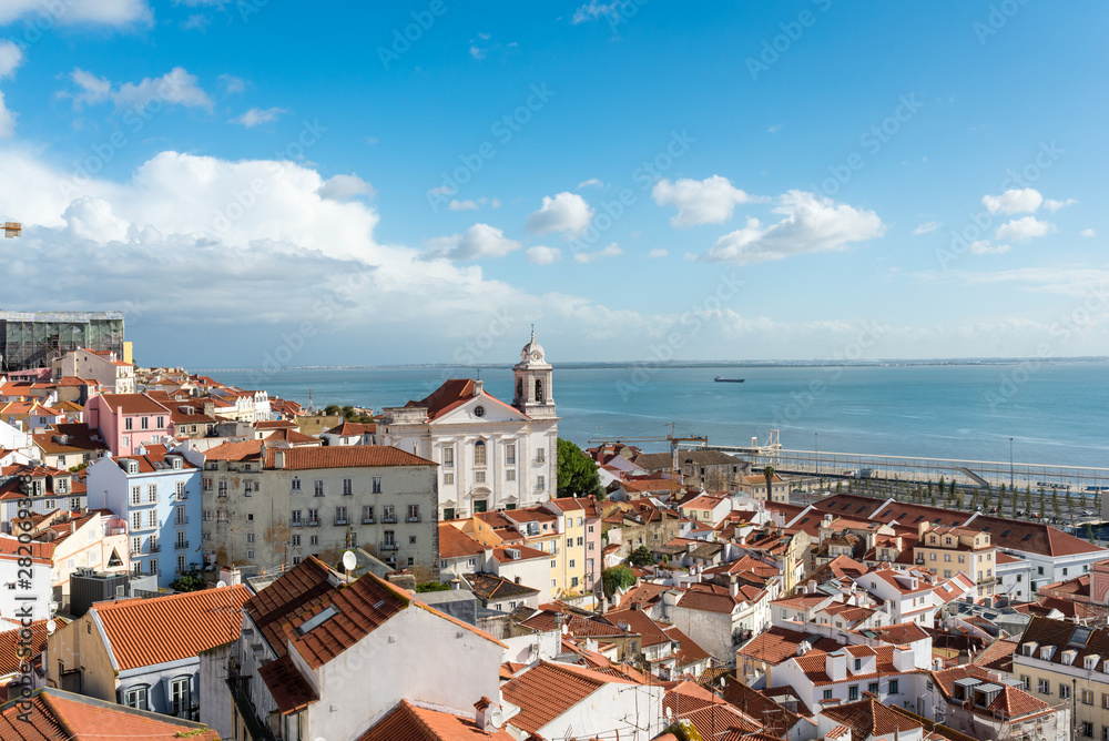 View over the roofs of the Alfama district to the Tagus river in Lisboa